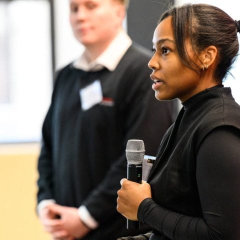 Doctoral student Faith Carter pitches her startup to an audience at the culminating BioEntrepreneurship Initiative workshop on March 18, 2023 in New York.