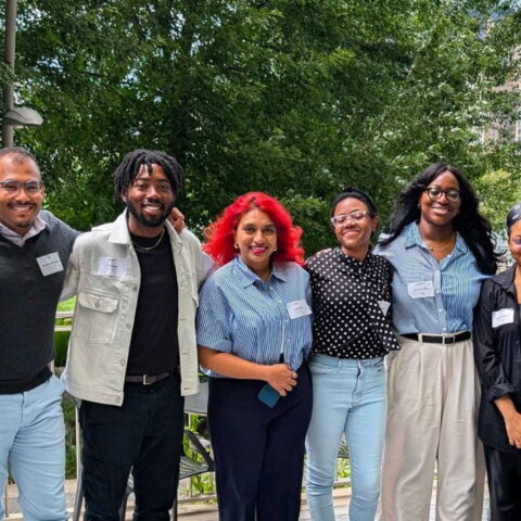 IN I-Corps participants smile together on an outdoor patio