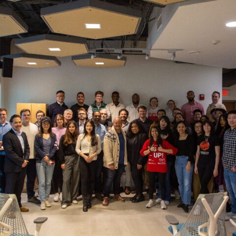 A group of MBA students poses for a photo at Rev: Ithaca startup works