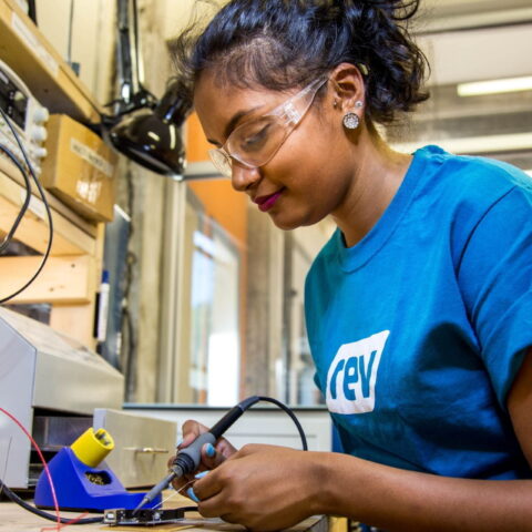 A female startup founder working on a prototype